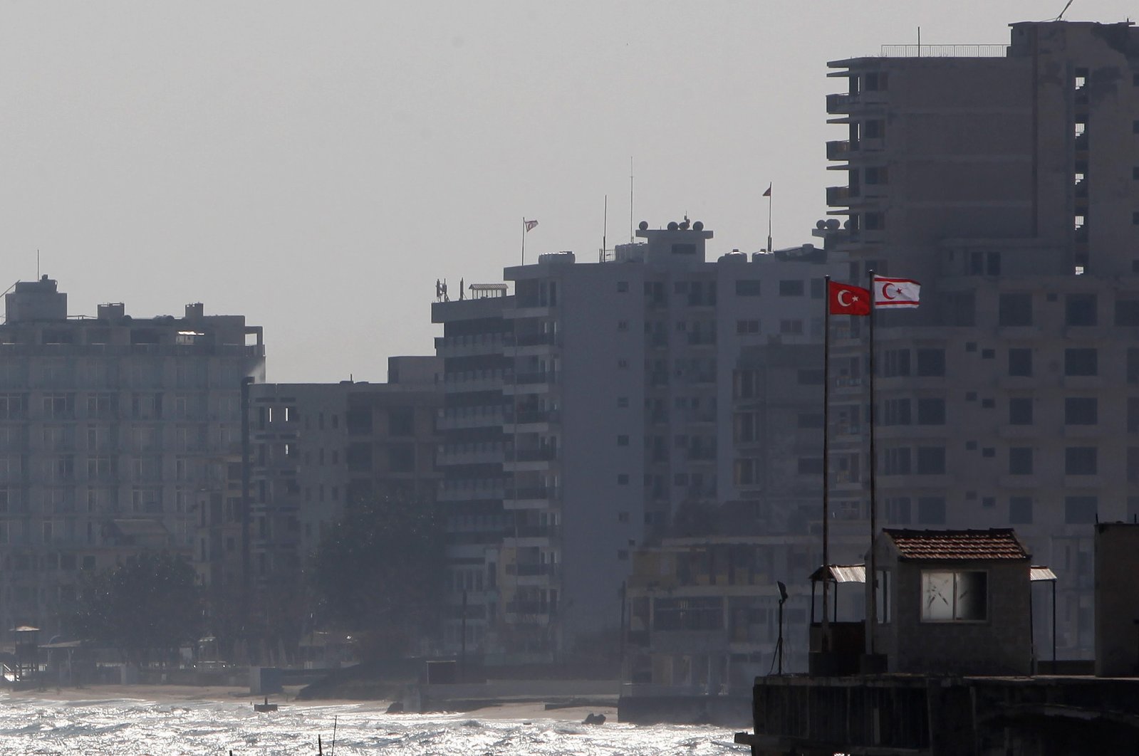 Turkish and Turkish Cypriot flags are seen on a military guard post in Gazimağusa or Famagusta, TRNC, Jan. 17, 2014. (AP Photo)