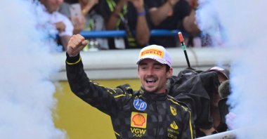 Winner Ferrari&#039;s Monegasque driver Charles Leclerc celebrates on the podium after the Italian Formula One Grand Prix race at Autodromo Nazionale Monza circuit, Monza, Italy, Sept. 1, 2024. (AFP Photo)