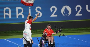 Turkish para-archer Öznur Cüre Girdi (R) celebrates after winning a gold medal at the 2024 Paris Paralympics, Paris, France, Aug. 31, 2024. (DHA Photo)