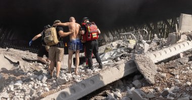Rescuers extract a survivor at the site of a Russian missile strike, in Kharkiv, Ukraine, Sept. 1, 2024. (Reuters Photo)