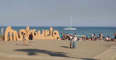 Tourists enjoy the weather at Malagueta Beach on a hot summer day in Malaga, Spain, Aug. 14, 2024. (Reuters Photo)
