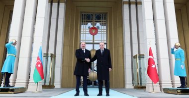 President Recep Tayyip Erdoğan shakes hands with Azerbaijani President Ilham Aliyev (L) at the Presidential Complex, Ankara, Türkiye, Feb. 19, 2024. (AA File Photo)