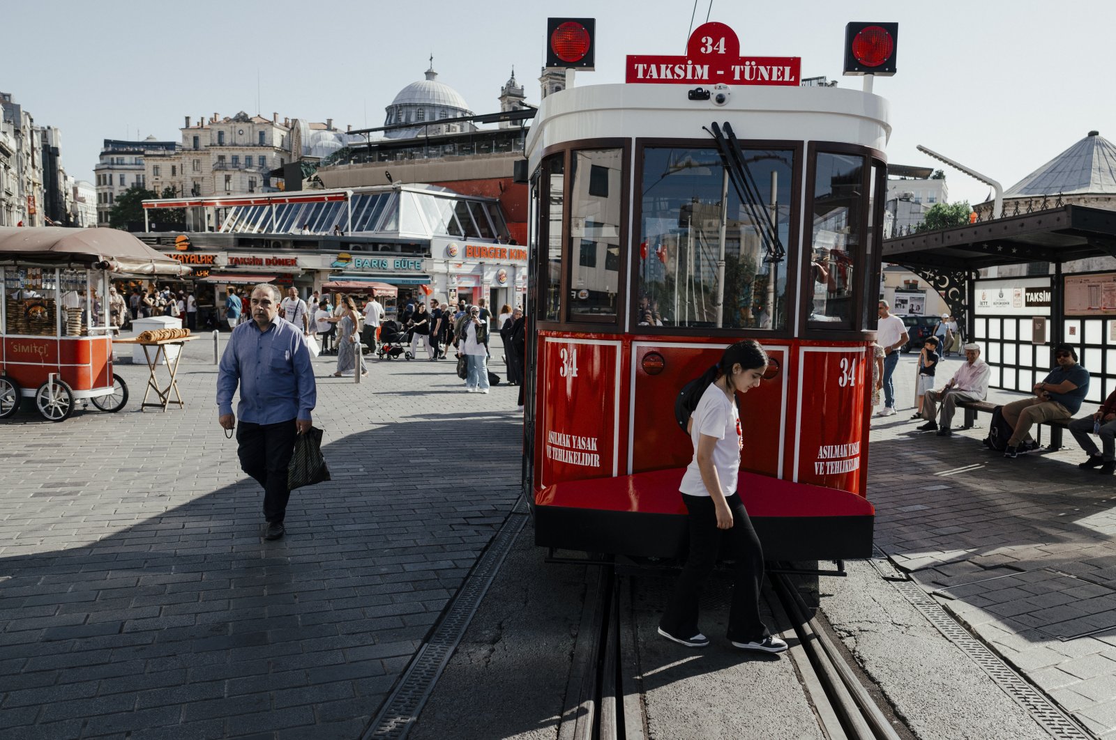 People pass by a tram on the famous Istiklal Street, Istanbul, Türkiye, June 5, 2024. (Reuters Photo)