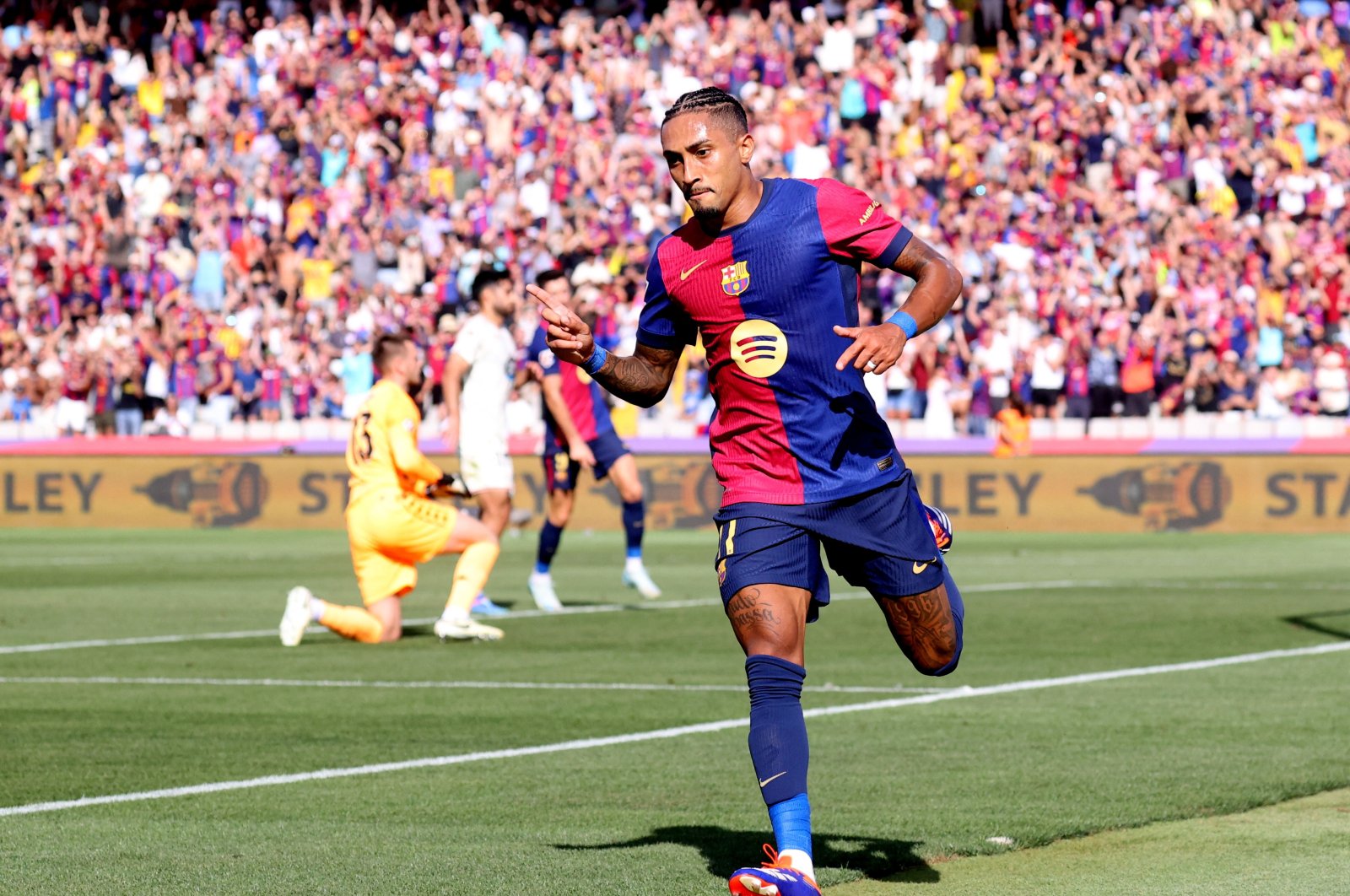 Barcelona&#039;s Raphinha celebrates scoring his first goal during the LaLiga match against Real Valladolid at the Estadi Olimpic Lluis Companys, Barcelona, Spain, Aug, 31, 2024. (Reuters Photo)