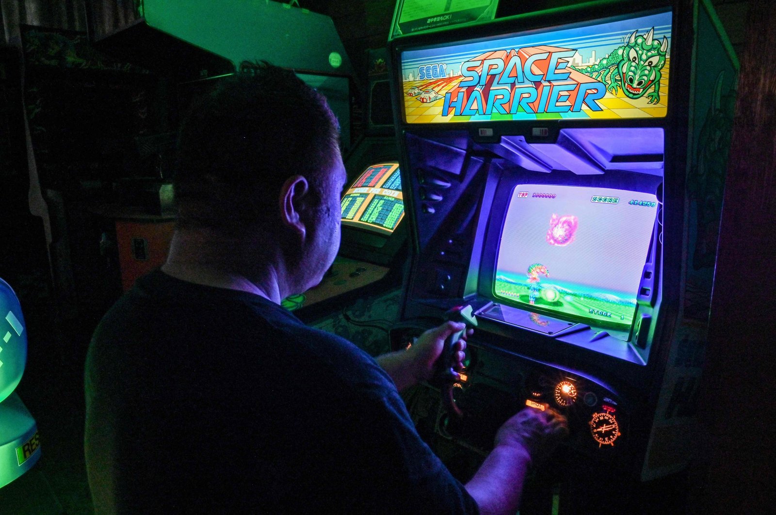 Vintage video game collector &quot;Proudro&quot; plays a vintage video game at his home in Kasumigaura, Ibaraki prefecture, Japan, June 24, 2024. (AFP Photo)