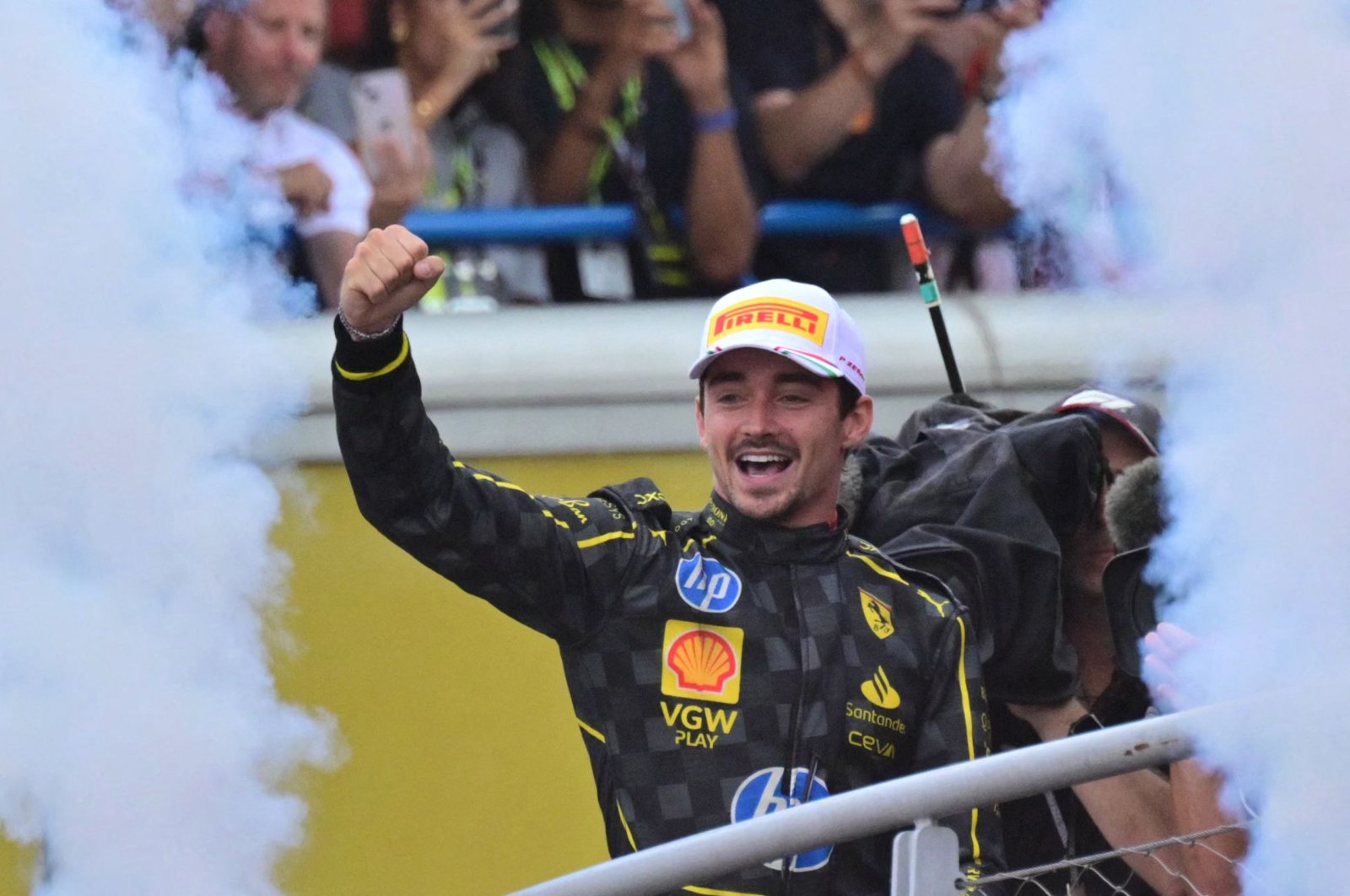 Winner Ferrari&#039;s Monegasque driver Charles Leclerc celebrates on the podium after the Italian Formula One Grand Prix race at Autodromo Nazionale Monza circuit, Monza, Italy, Sept. 1, 2024. (AFP Photo)