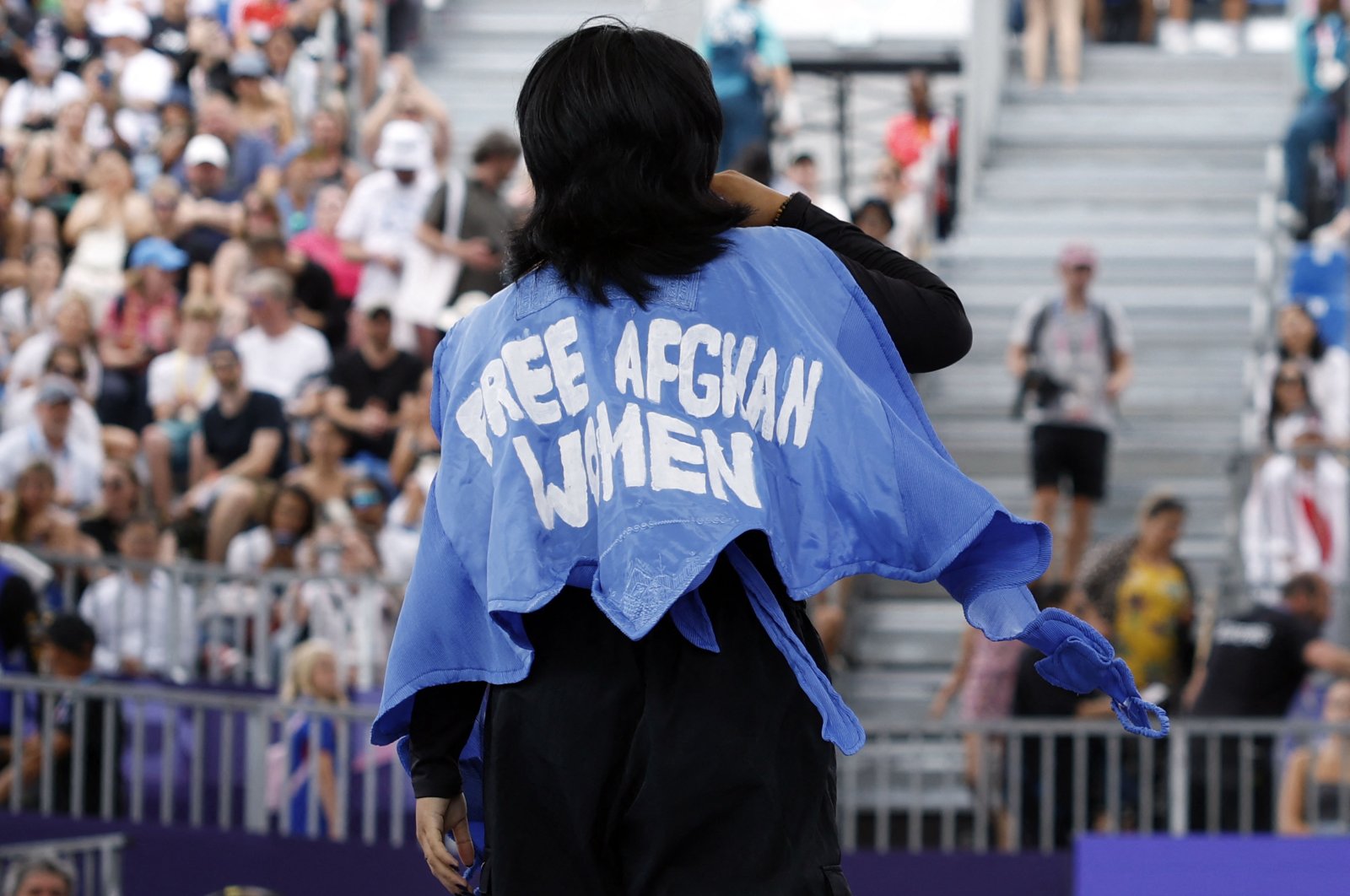 Refugee Olympic team&#039;s Manizha Talash, known as Manizha, wears a jacket reading "Free Afghan women" as she competes in the Women&#039;s Breaking dance qualifying round of the Paris 2024 Olympic Games at La Concorde, Paris, France, Aug. 9, 2024. (AFP Photo)