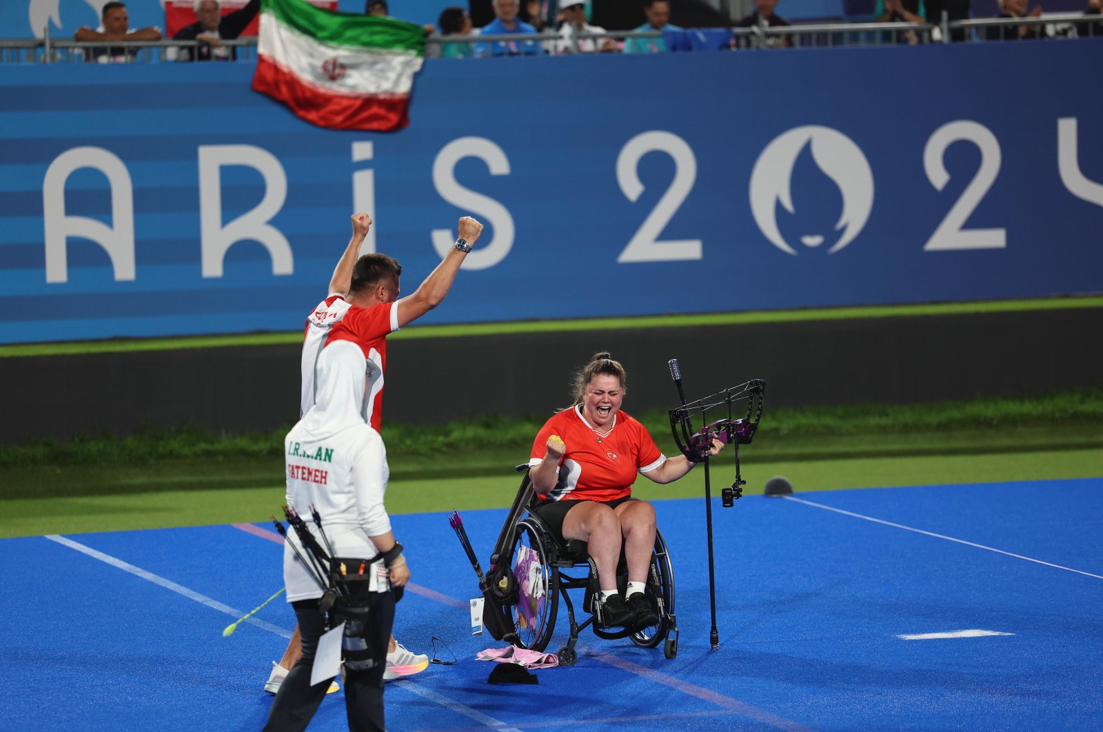 Turkish para-archer Öznur Cüre Girdi (R) celebrates after winning a gold medal at the 2024 Paris Paralympics, Paris, France, Aug. 31, 2024. (DHA Photo)