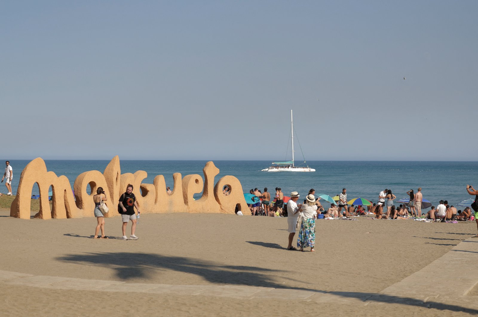 Tourists enjoy the weather at Malagueta Beach on a hot summer day in Malaga, Spain, Aug. 14, 2024. (Reuters Photo)