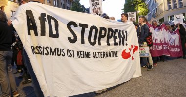 Participants in a demonstration against the growing far-right sentiment hold a banner with the slogan &quot;Stop (Alternative for Germany) AfD! Racism is not an alternative&quot; in Hamburg, Germany, Sept. 1, 2024. (Bodo Marks/dpa via AP)