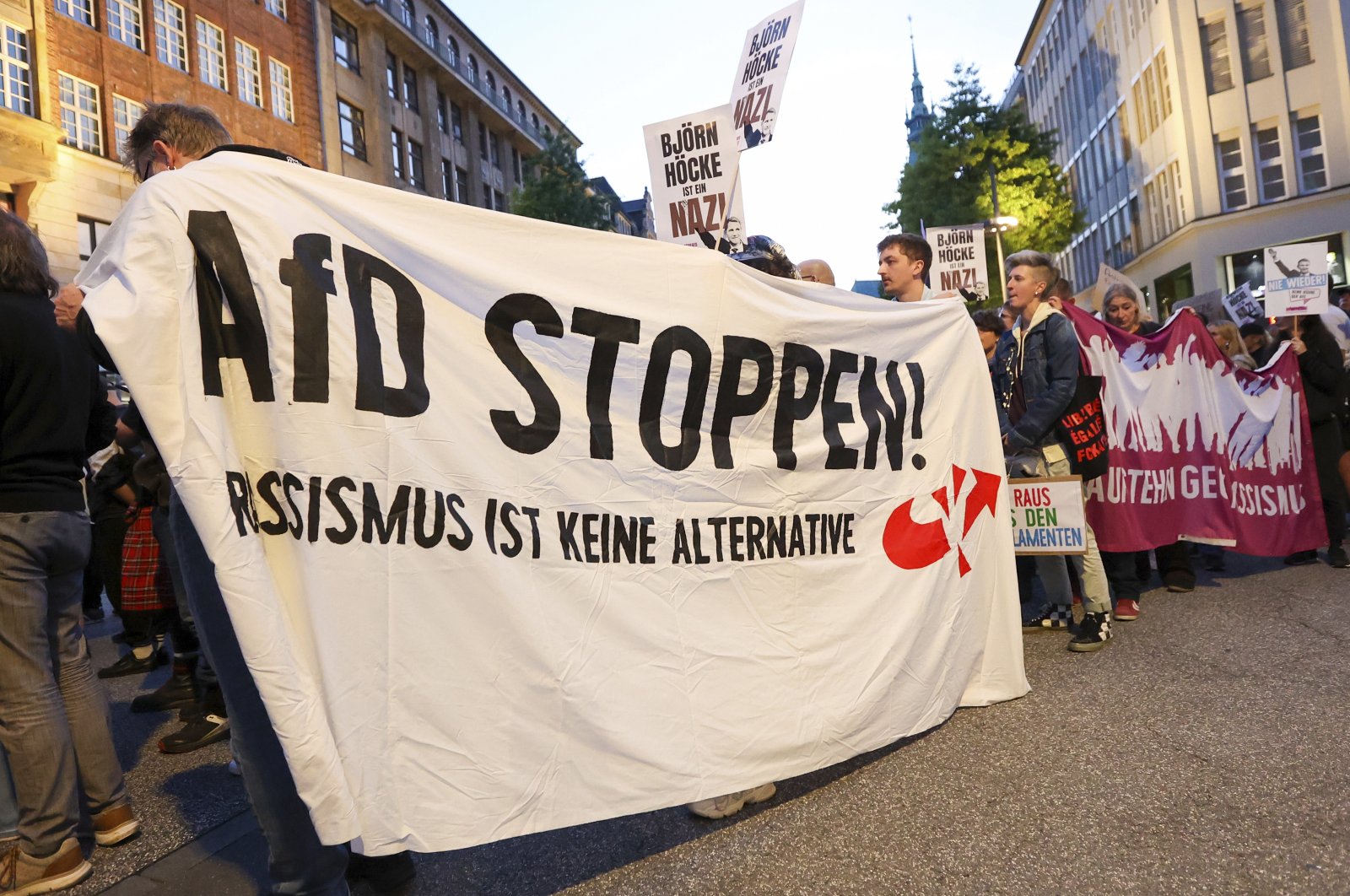 Participants in a demonstration against the growing far-right sentiment hold a banner with the slogan &quot;Stop (Alternative for Germany) AfD! Racism is not an alternative&quot; in Hamburg, Germany, Sept. 1, 2024. (Bodo Marks/dpa via AP)