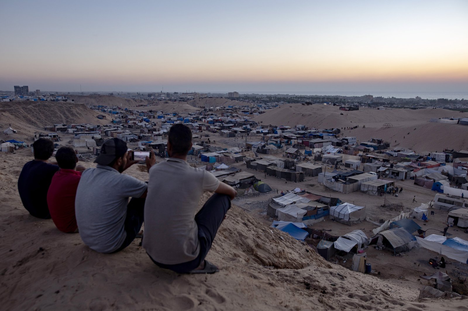 Displaced Palestinians who fled their homes due to Israeli airstrikes and evacuation orders take shelter in a tent camp in Khan Younis, southern Gaza Strip, Palestine, Aug. 25, 2024. (EPA Photo)