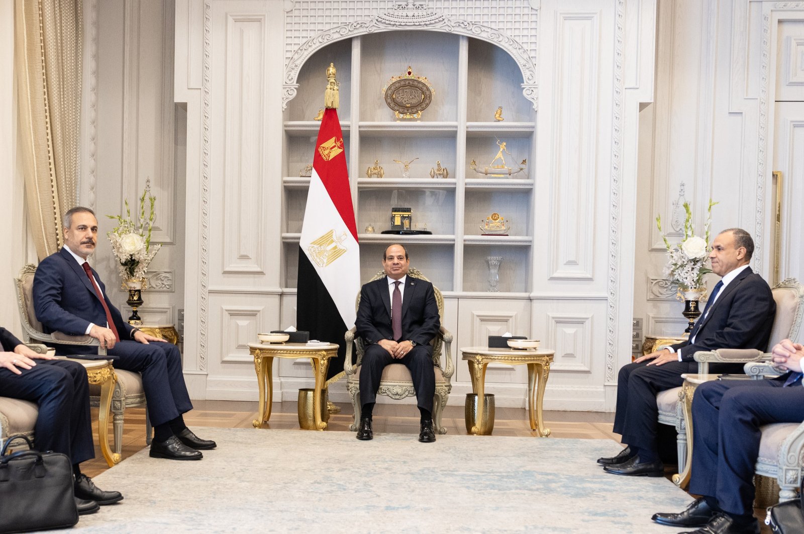 Egyptian President Abdel-Fattah el-Sissi (C) receives Foreign Minister Hakan Fidan (L), Alamein, Egypt, Aug. 5, 2024. (AA Photo)