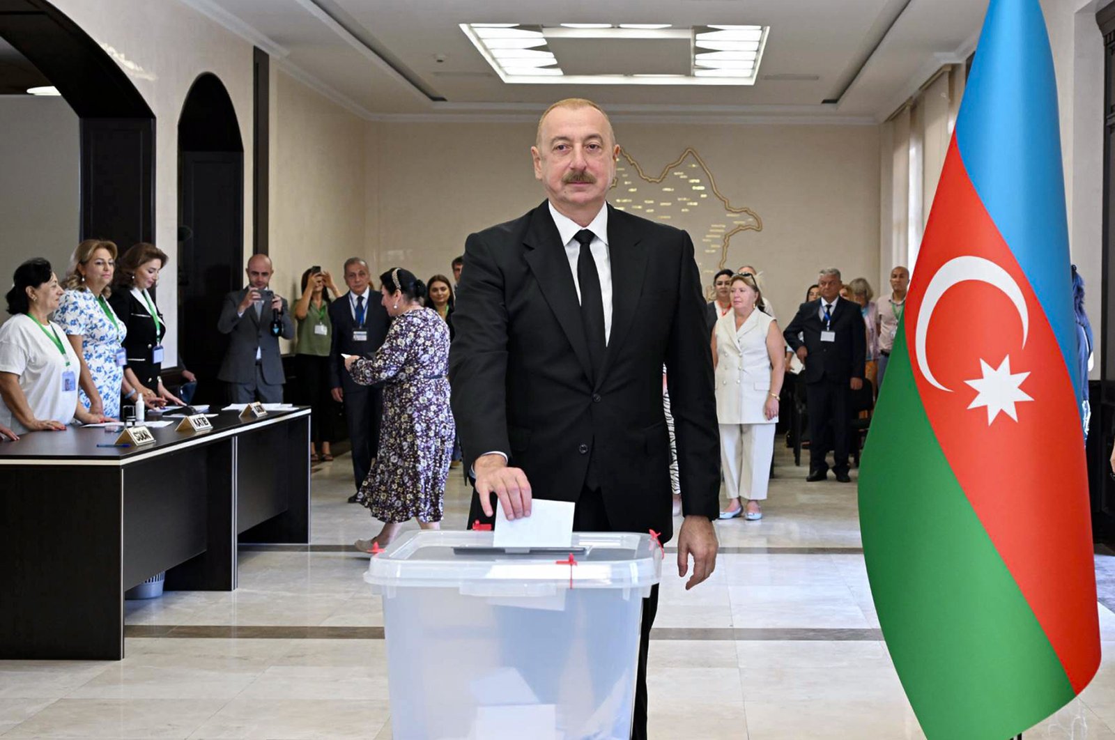 In this photo provided by the Azerbaijan's Presidential Press Office, Azerbaijani President Ilham Aliyev casts his ballot at a polling station during a snap election in the Milli Mejlis parliament in Baku, Azerbaijan, Sunday, Sept. 1, 2024. (Azerbaijani Presidential Press Office via AP)