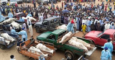 Trucks carry bodies of people killed by Boko Haram terrorists, during their funeral in Yobe, Nigeria, Sept. 3, 2024. (Reuters Photo)
