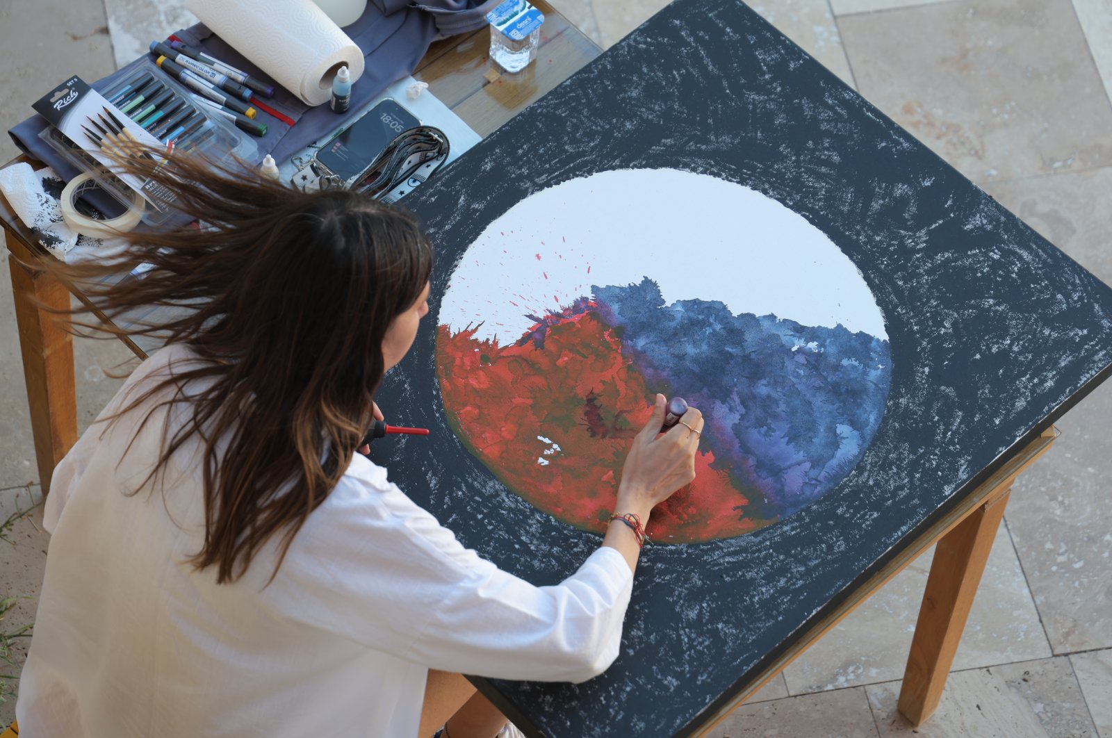 Artist Melike Kara works during the workshop, Bayburt, Türkiye, Aug. 18, 2024. (Photo courtesy of Arnica)