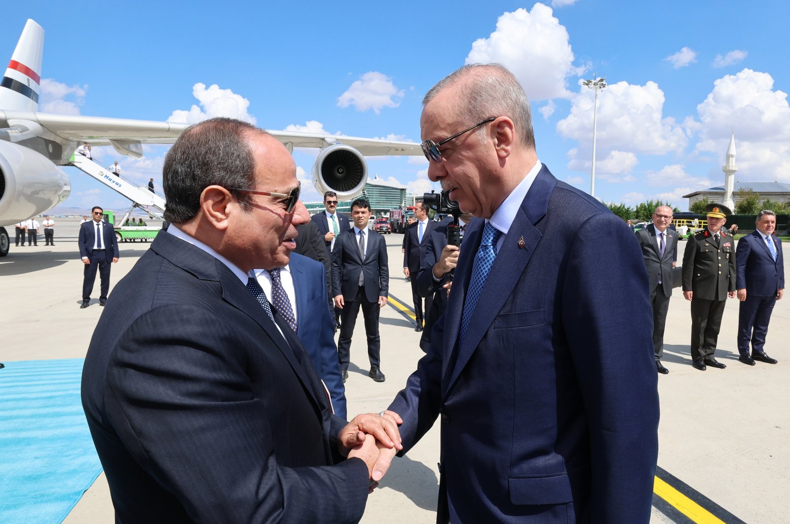 President Recep Tayyip Erdoğan shakes hands with Egyptian President Abdel-Fattah el-Sissi at the airport, Ankara, Türkiye, Sept. 4, 2024. (AA Photo)