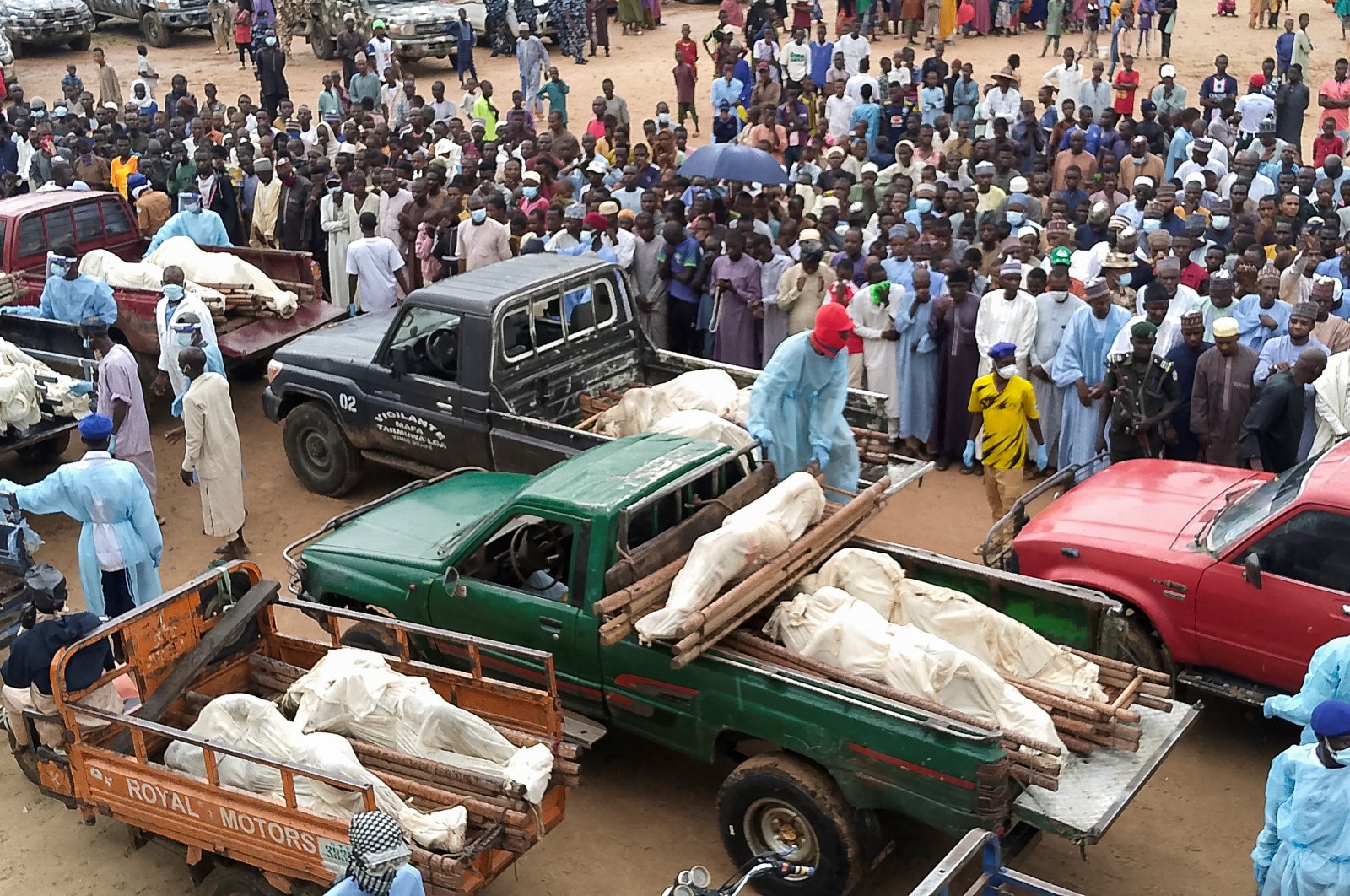 Trucks carry bodies of people killed by Boko Haram terrorists, during their funeral in Yobe, Nigeria, Sept. 3, 2024. (Reuters Photo)