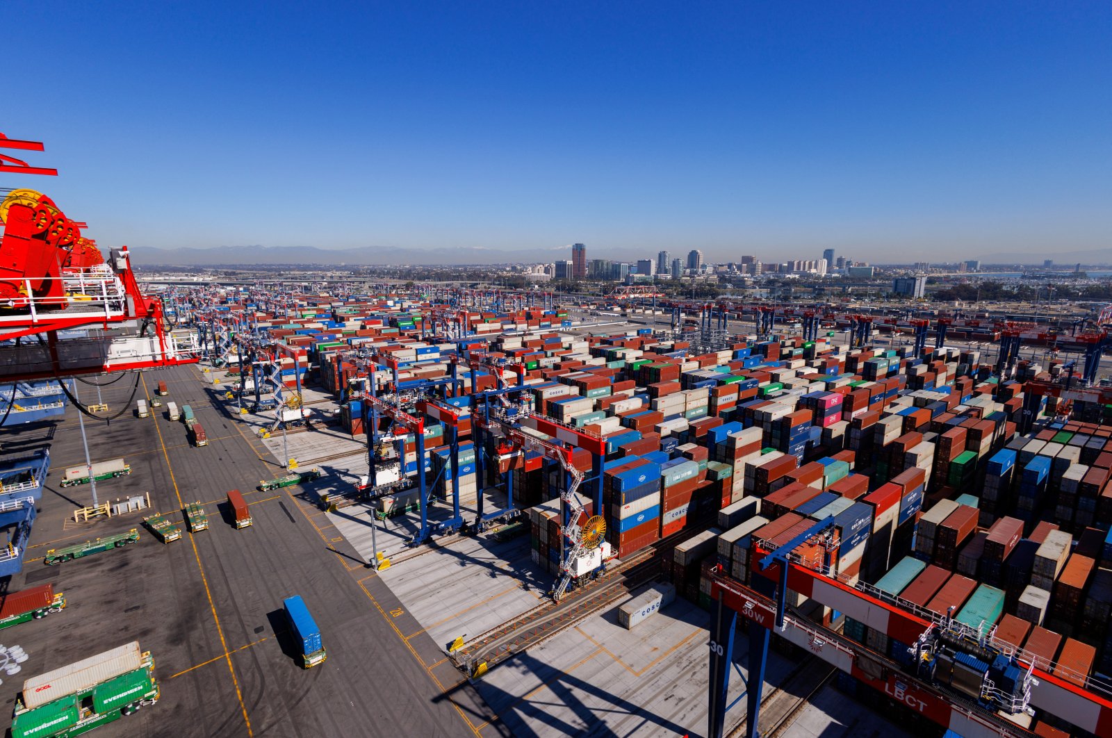 Automated electric trucks transport shipping containers at the Long Beach Container Terminal in Long Beach, California, U.S., Feb. 9, 2023. (Reuters Photo)