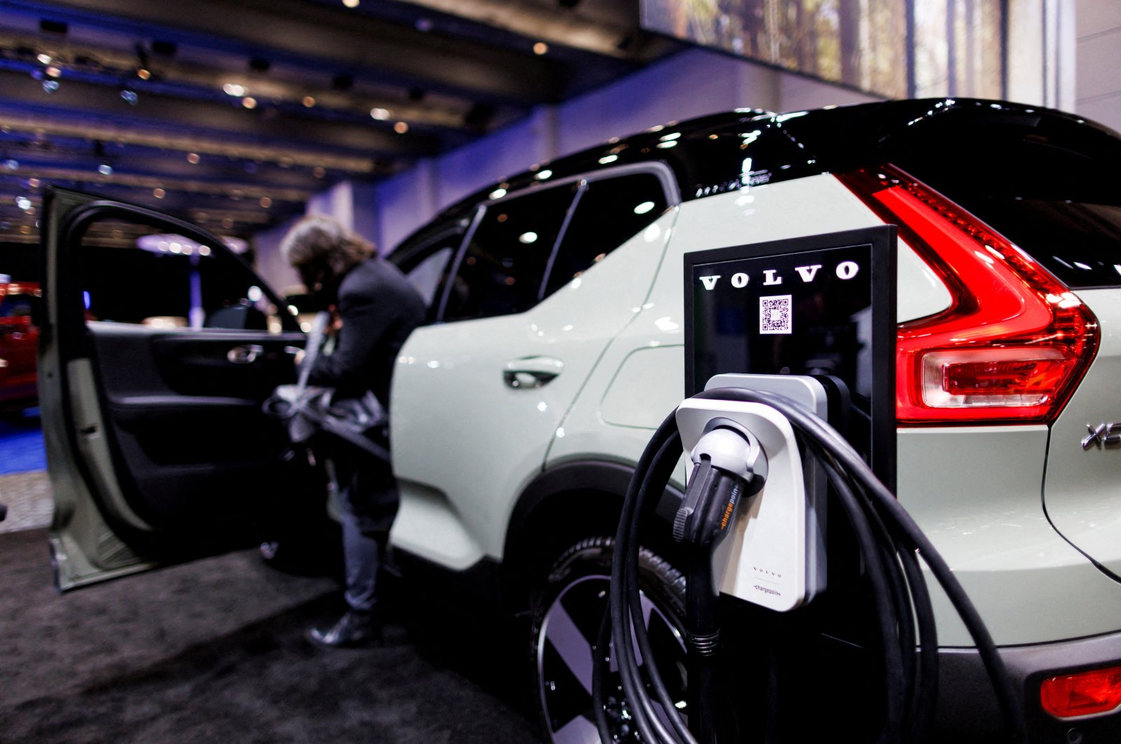 An EV charger next to a Volvo car at the Canadian International Auto Show in Toronto, Ontario, Canada, Feb. 15, 2024. (Reuters Photo)