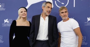 From left, U.S. singer and actor Lady Gaga, U.S. director Todd Phillips and U.S. actor Joaquin Phoenix pose at a photocall for "Joker: Folie a Deux" during the 81st annual Venice International Film Festival, Venice, Italy, Sept. 4, 2024. (EPA Photo)