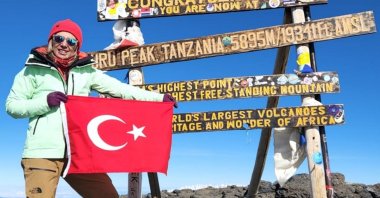 Turkish mountaineer Nurhan Cengiz poses on the peak of Mount Kilimanjaro, Tanzania, Sept. 5, 2024. (AA Photo)