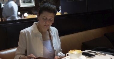 Parisa Imanirad, a scientist and cancer researcher, eats lunch alone at Spruce, an upscale restaurant in San Francisco, Aug. 22, 2024. (AP Photo)