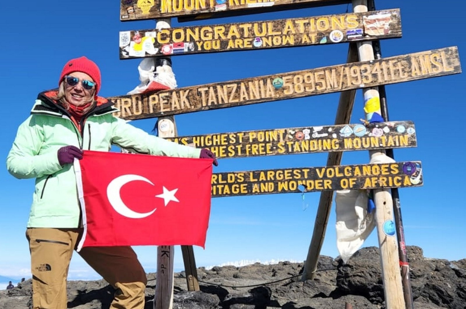 Turkish mountaineer Nurhan Cengiz poses on the peak of Mount Kilimanjaro, Tanzania, Sept. 5, 2024. (AA Photo)