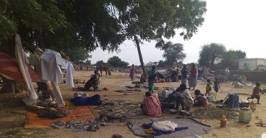 Residents displaced from a surge of violent attacks squat on blankets and in hastily made tents in the village of Masteri, west Darfur, Sudan, July 30, 2020. (AP Photo)