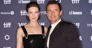 Irish actress Caitriona Balfe (L) and British actor Orlando Bloom arrive for the premiere of &quot;The Cut&quot; during the Toronto International Film Festival, Toronto, Canada, Sept. 5, 2024. (AFP Photo)