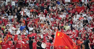 Supporters for the Chinese team cheer during a World Cup and AFC Asian Qualifier between Japan and China at Saitama Stadium 2002, Saitama, Tokyo, Sept. 5, 2024.(AP Photo)