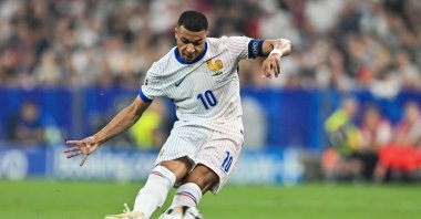 France's Kylian Mbappe attempts a shot during the UEFA Euro 2024 semifinal football match between Spain and France at the Munich Football Arena, Munich, Germany, July 9, 2024. (AFP Photo)