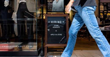 A hiring sign is displayed in front of Charles Tyrwhitt at the Tysons Corner Center Mall in Alexandria, Virginia, U.S., Aug. 22, 2024. (AFP Photo)