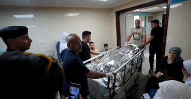 The body of Turkish-American activist Ayşenur Ezgi Eygi carried in a hospital in the West Bank, Friday, Sept. 6, 2024. (AA Photo)