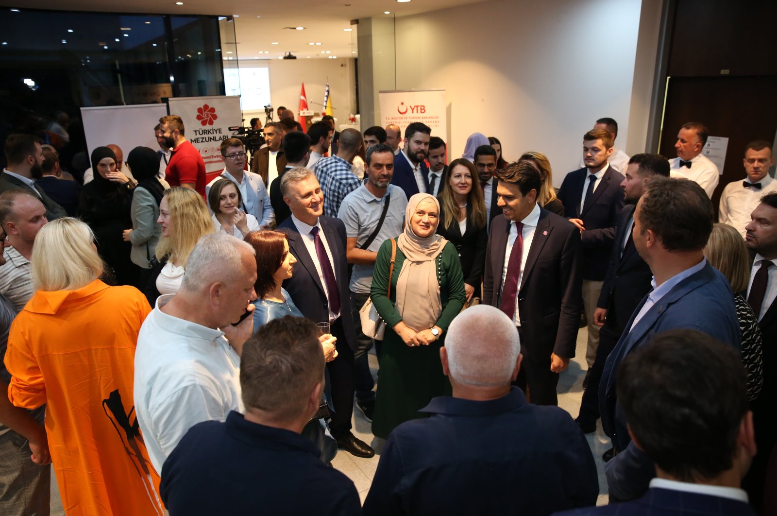 Graduates from the Turkish universities and the Presidency for Turks Abroad and Related Communities (YTB) officials gather at an event in Sarajevo, Bosnia-Herzegovina, Sept. 5, 2024. (AA Photo)