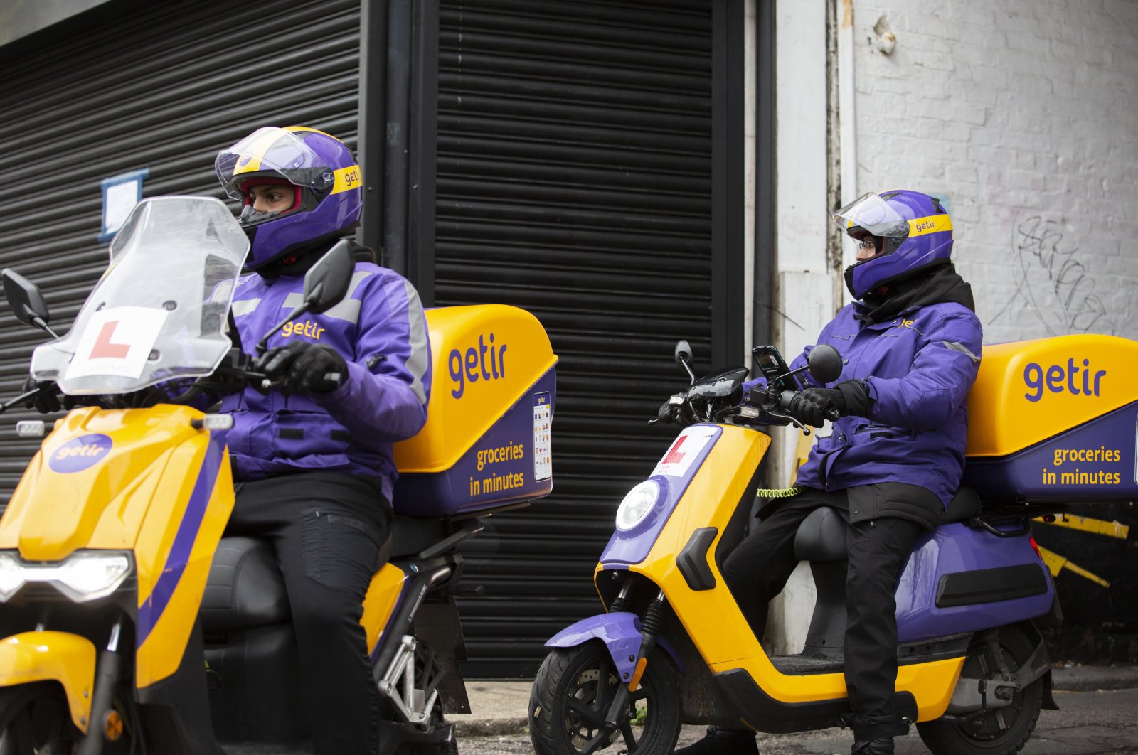 Getir couriers are seen in London, Britain, Dec. 30, 2021. (AA Photo)