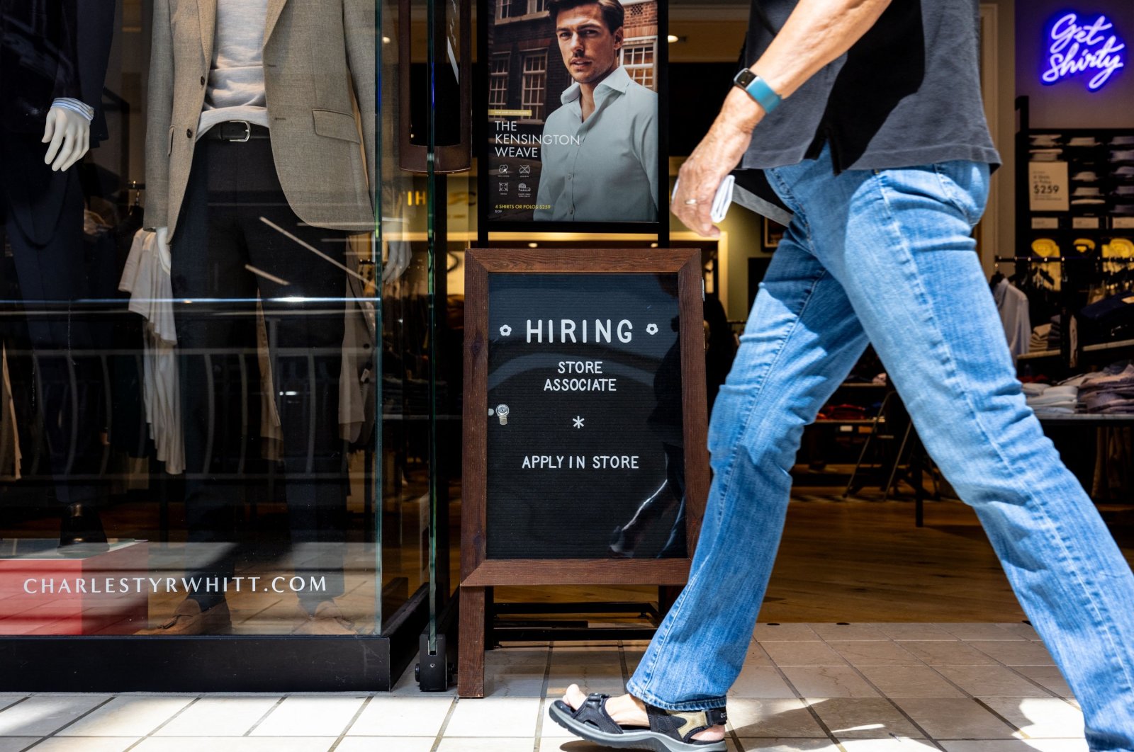 A hiring sign is displayed in front of Charles Tyrwhitt at the Tysons Corner Center Mall in Alexandria, Virginia, U.S., Aug. 22, 2024. (AFP Photo)