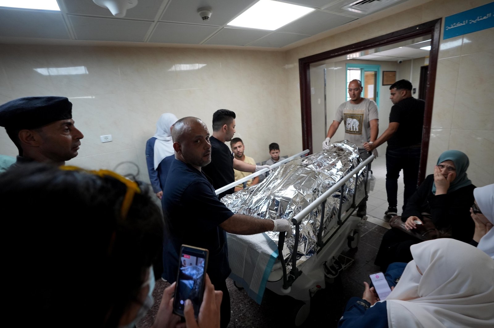 The body of Turkish-American activist Ayşenur Ezgi Eygi carried in a hospital in the West Bank, Friday, Sept. 6, 2024. (AA Photo)