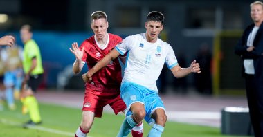Liechtenstein's Simon Luchinger (L) and San Marino's Andrea Contadini compete for the ball during the UEFA Nations League 2024/2025 League D - Group 1 match between San Marino and Liechtenstein at San Marino Stadium, San Marino, San Marino, Sept. 5, 2024. (Getty Images Photo)