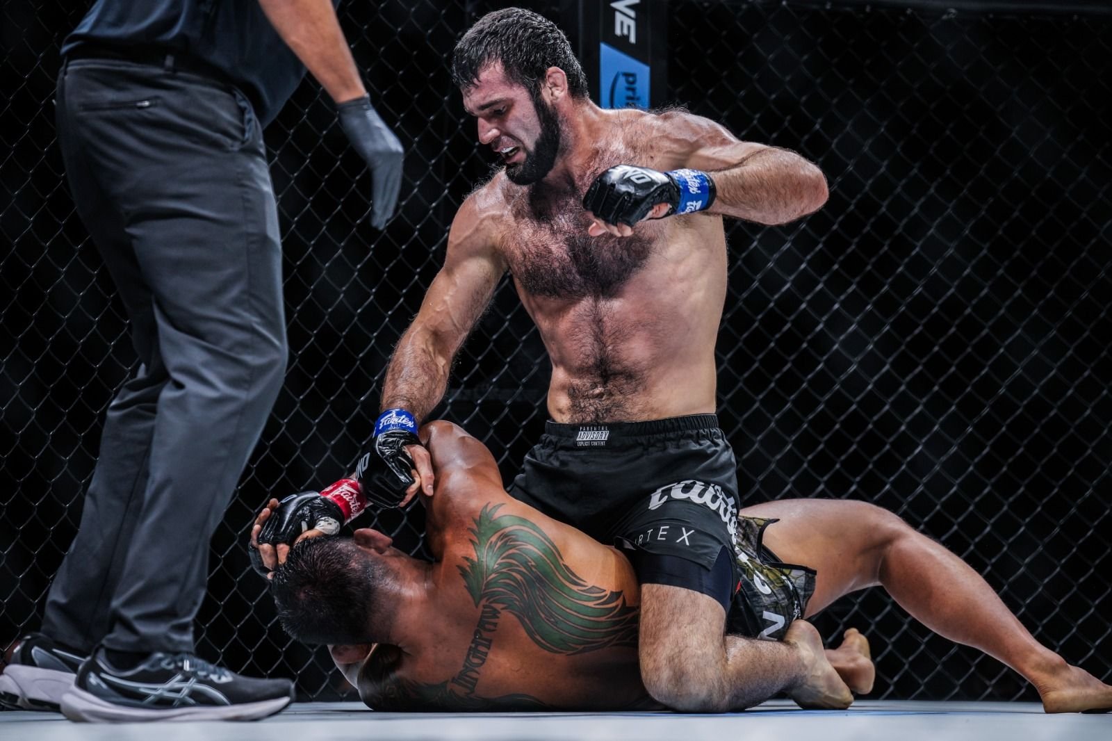 Turkish MMA fighter Shamil Erdoğan pounds on U.S.&#039; Aung La N Sang at the ONE 168, Denver, U.S., Sept. 7, 2024. (Photo by Lara Badreddine)