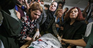 Palestinians and international activists mourn by the body of slain Turkish American activist Aysenur Ezgi Eygi at the Al-Rafidia Hospital morgue in Nablus, the occupied West Bank, Palestine, Sept. 8, 2024. (AFP Photo)