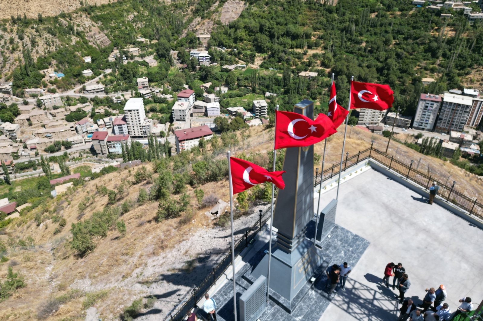 Villagers hold a ceremony to commemorate 154 soldiers, rangers and civilians killed by the PKK in 2017 at a monument in the southeastern Şırnak province, Türkiye, Sept. 6, 2024. (AA Photo)