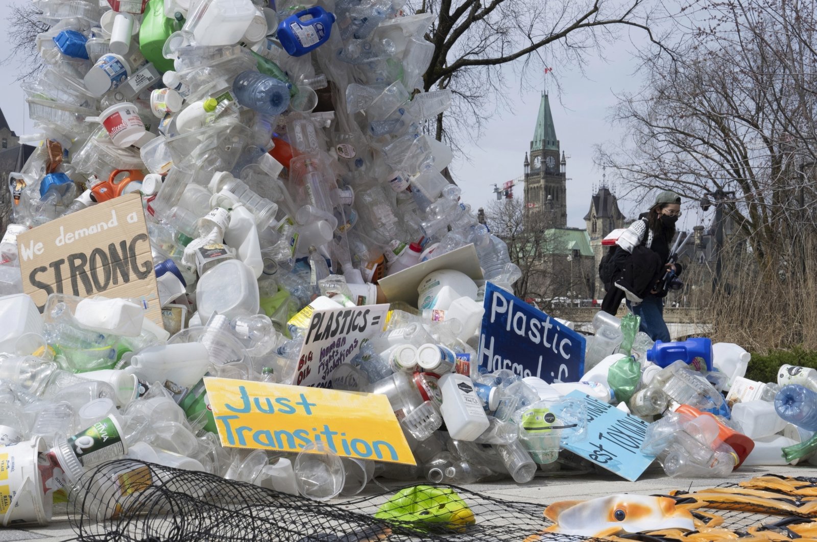 A person walks past an art installation outside a United Nations conference on plastics, Ottawa, Canada, April 23, 2024. (AP Photos)