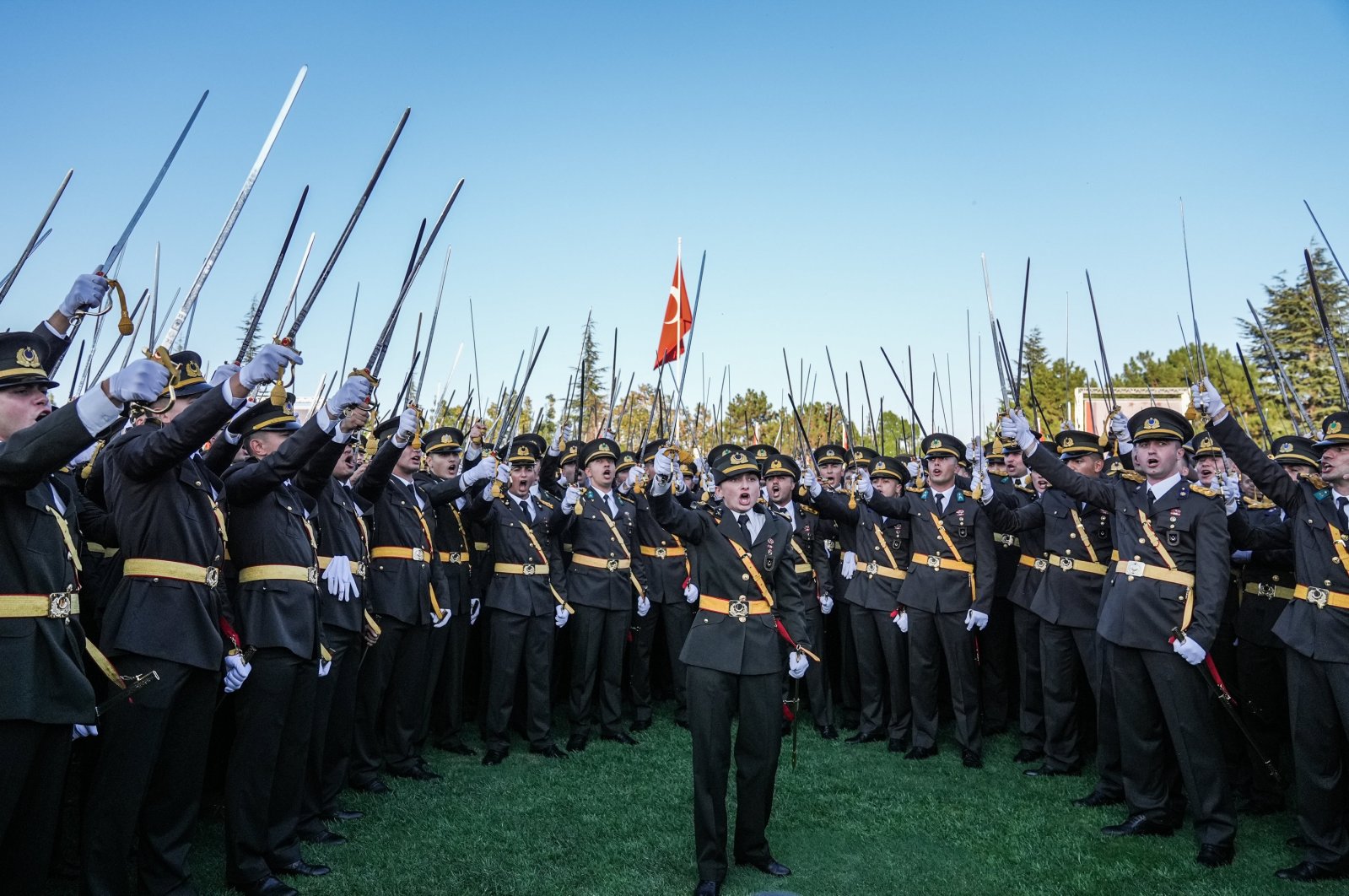 Graduating students perform a sword oath at a recent Military Academy graduation in the capital of Ankara, Türkiye, Aug. 30, 2024. (AA Photo)