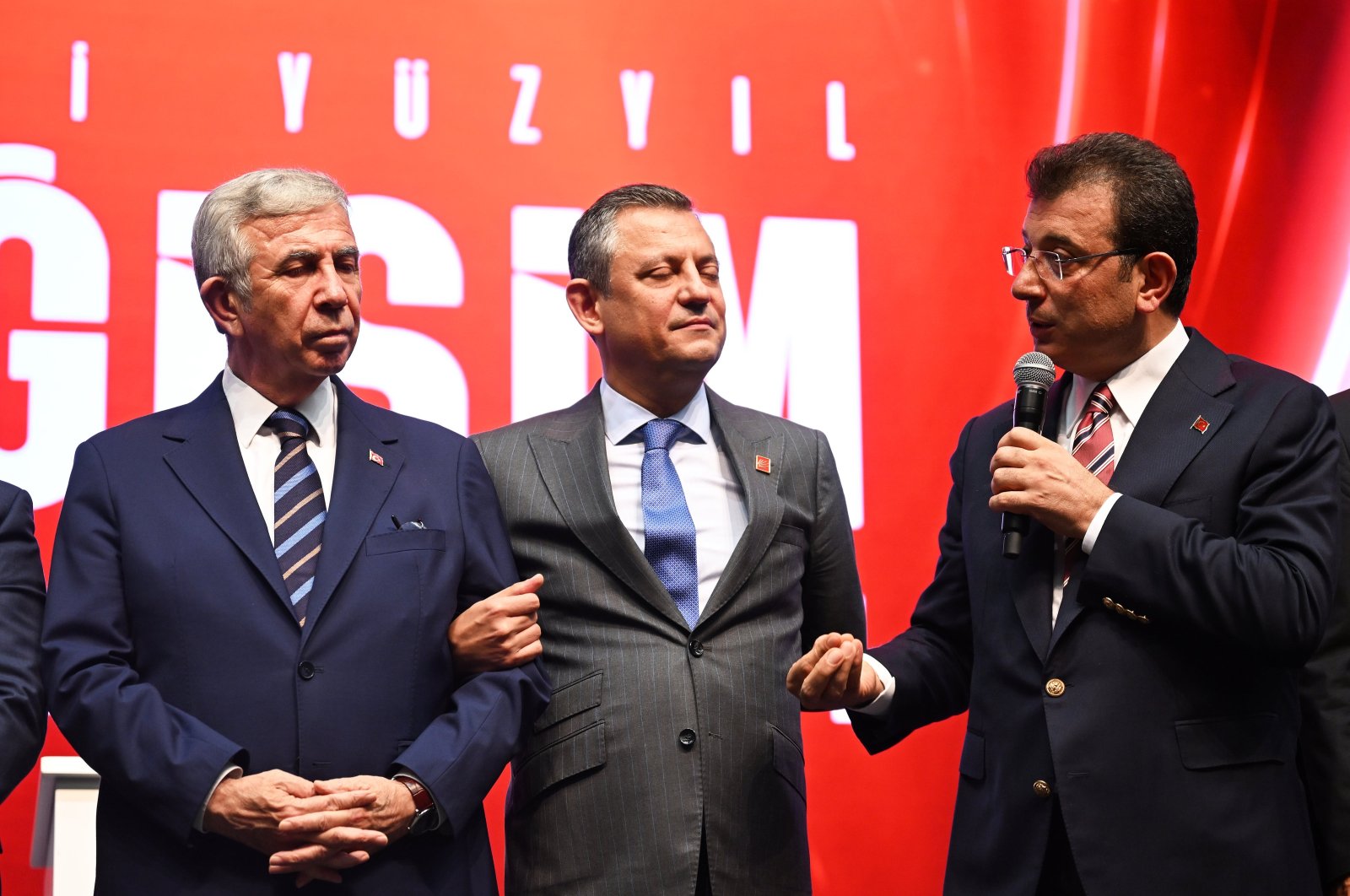 Ankara Mayor Mansur Yavaş (L) and Republican People&#039;s Party&#039;s (CHP) Chair Özgür Özel (C) listen as Istanbul Mayor Ekrem Imamoğlu (R) speaks at the CHP&#039;s charter convention, Ankara, Türkiye, Sept. 7, 2024. (AA Photo)