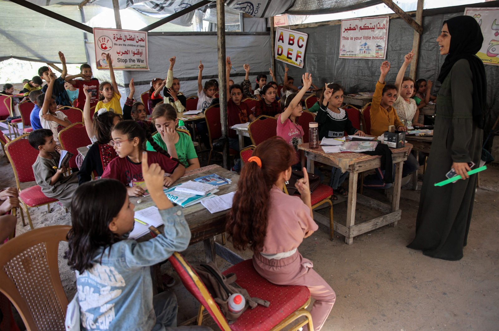 Children attend a class in a tent being used as a make-shift educational center, in Jabalia, northern Gaza Strip, Palestine, Sept. 8, 2024. (AFP Photo)