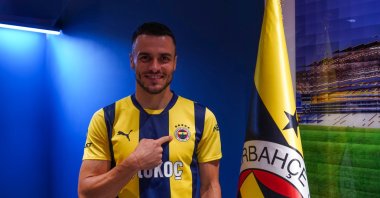 Fenerbahçe&#039;s Filip Kostic poses for a photo after signing his contract, Istanbul, Türkiye, Sept. 9, 2024. (DHA Photo)