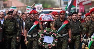 Members of Palestinian security forces carry the body of slain Turkish American International Solidarity Movement activist Ayşenur Ezgi Eygi during a funeral procession in Nablus, occupied West Bank, Palestine, Sept. 9, 2024. (AFP Photo)