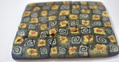 One of the Millefiori wall panels found during excavations in Andriake port, Antalya, Türkiye, Sept. 10, 2024. (IHA Photo)