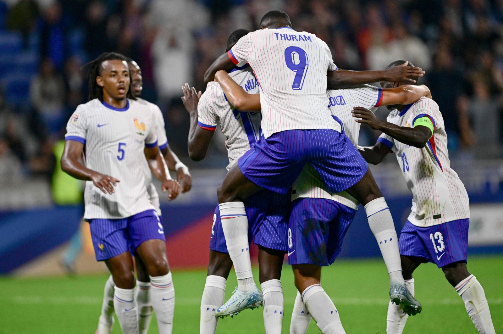 France&#039;s Marcus Thuram (C) congratulates Randal Kolo Muani&#039;s goal during the UEFA Nations League, League A Group 2 first leg football match between France and Belgium at the Parc Olympique Lyonnais, Lyon, France, Sept. 9, 2024. (AFP Photo)